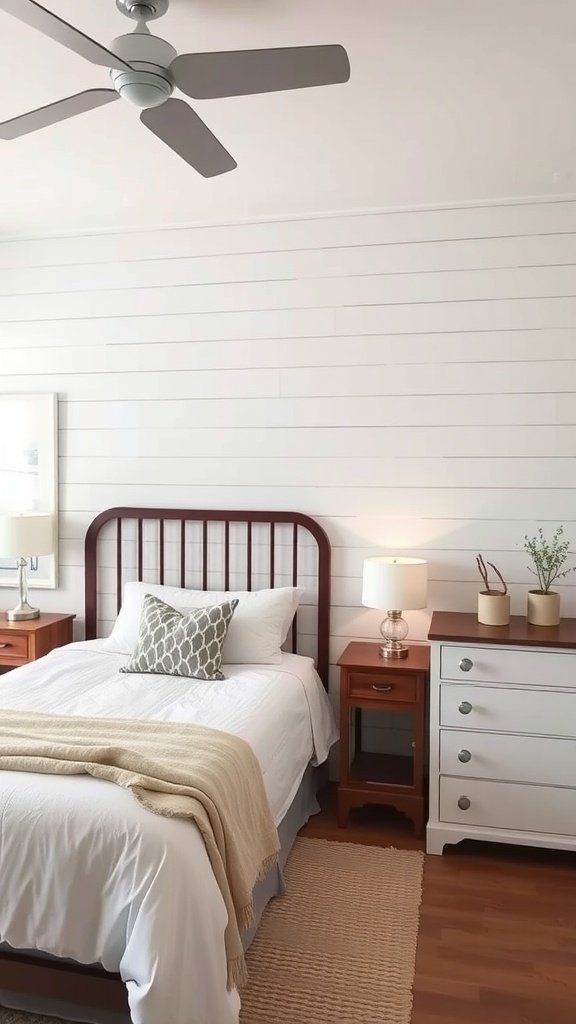 Cozy farmhouse guest bedroom featuring a shiplap accent wall, wooden furniture, and soft bedding.